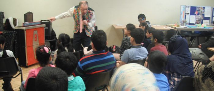 Children enjoying a magic show during Khaas Open Day.